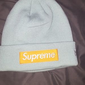 Green beanie with yellow box logo (real)
